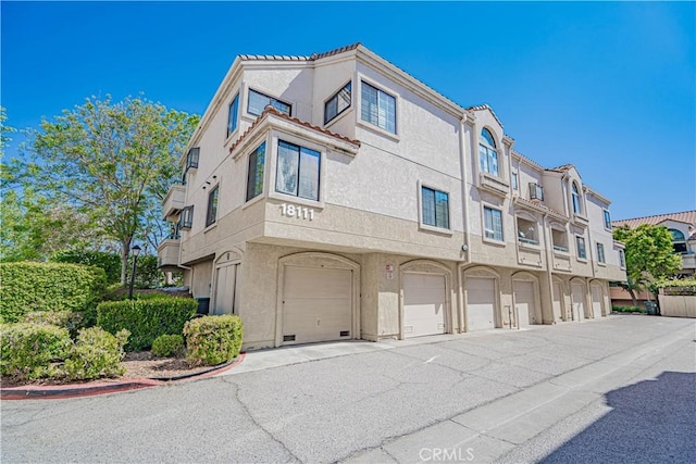 18111 Erik Ct Unit 445, Canyon Country, CA 91387 - view of building exterior featuring a garage