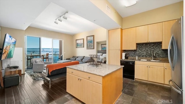 488 E Ocean Blvd Unit 708, Long Beach, CA 90802 - kitchen featuring dishwasher, a sink, light brown cabinetry, open floor plan, and freestanding refrigerator
