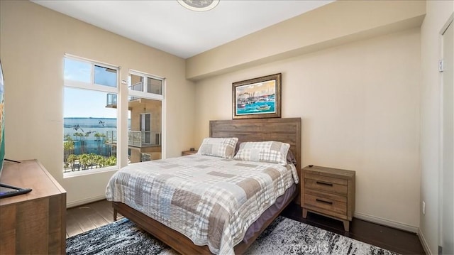 488 E Ocean Blvd Unit 708, Long Beach, CA 90802 - bedroom featuring wood finished floors and baseboards