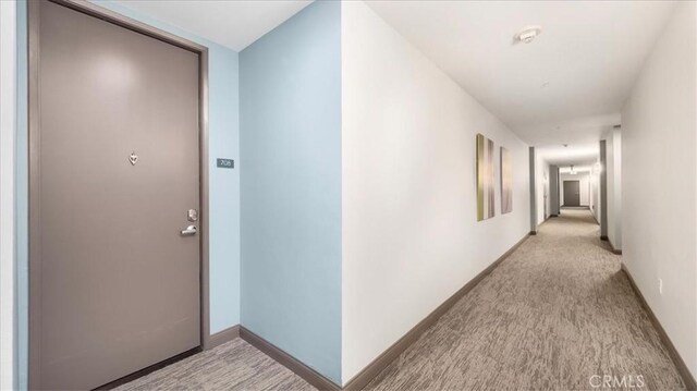 488 E Ocean Blvd Unit 708, Long Beach, CA 90802 - corridor featuring light carpet and baseboards