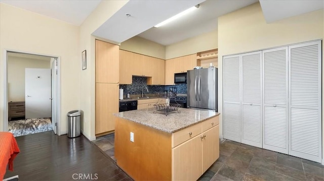 488 E Ocean Blvd Unit 708, Long Beach, CA 90802 - kitchen featuring black appliances, light brown cabinetry, a center island, tasteful backsplash, and light stone counters