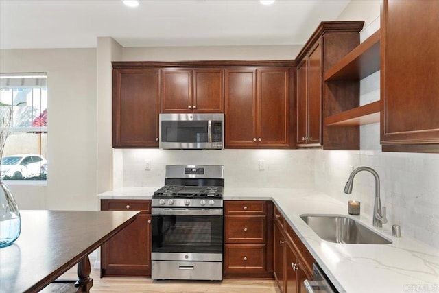 1514 Crown Ln Unit 1, Chula Vista, CA 91915 - kitchen featuring stainless steel appliances, open shelves, decorative backsplash, light stone counters, and recessed lighting