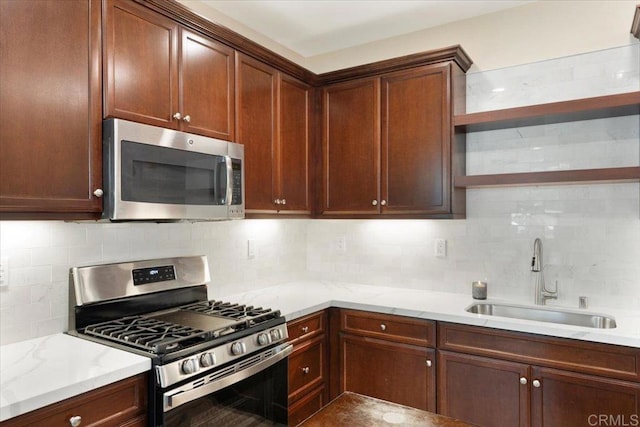 1514 Crown Ln Unit 1, Chula Vista, CA 91915 - kitchen featuring stainless steel appliances, open shelves, tasteful backsplash, and light stone counters