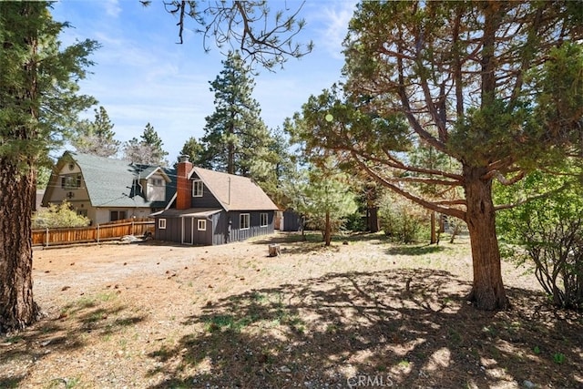 441 Sunset Ln, Sugarloaf, CA 92386 - back of property featuring fence and a chimney