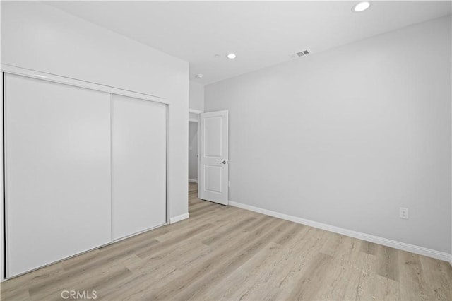 40729 171th, Lake Los Angeles, CA 93535 - unfurnished bedroom featuring light wood-style flooring, recessed lighting, a closet, and baseboards