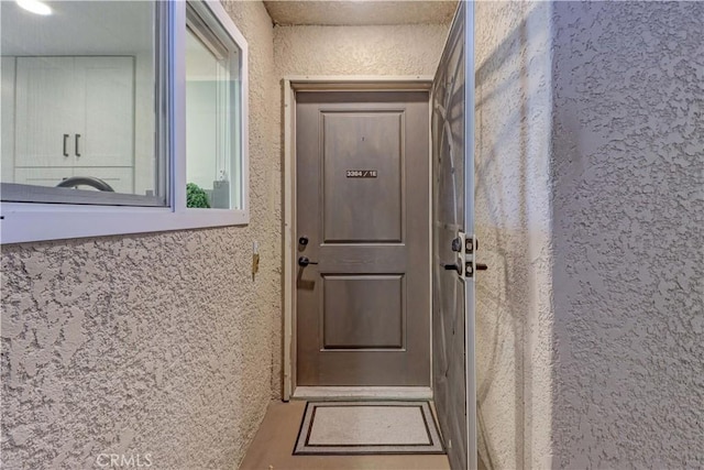 3364 Punta Alta Unit 1E, Laguna Woods, CA 92637 - view of exterior entry with stucco siding