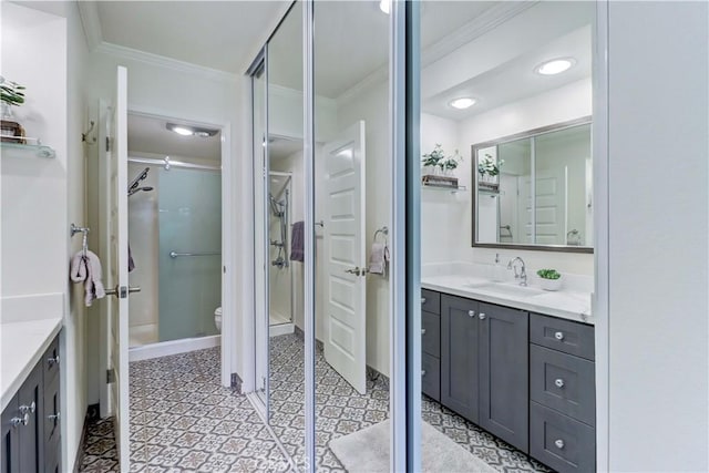 3364 Punta Alta Unit 1E, Laguna Woods, CA 92637 - full bath with ornamental molding, vanity, toilet, tile patterned floors, and a shower