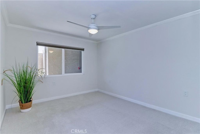 3364 Punta Alta Unit 1E, Laguna Woods, CA 92637 - carpeted spare room with baseboards, crown molding, and a ceiling fan