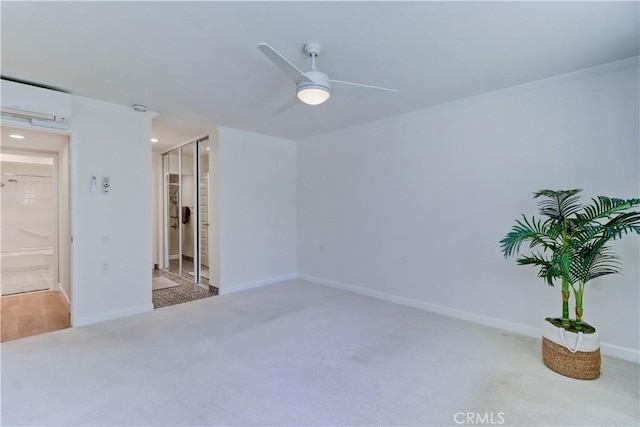 3364 Punta Alta Unit 1E, Laguna Woods, CA 92637 - spare room with carpet, ceiling fan, a wall mounted air conditioner, crown molding, and baseboards