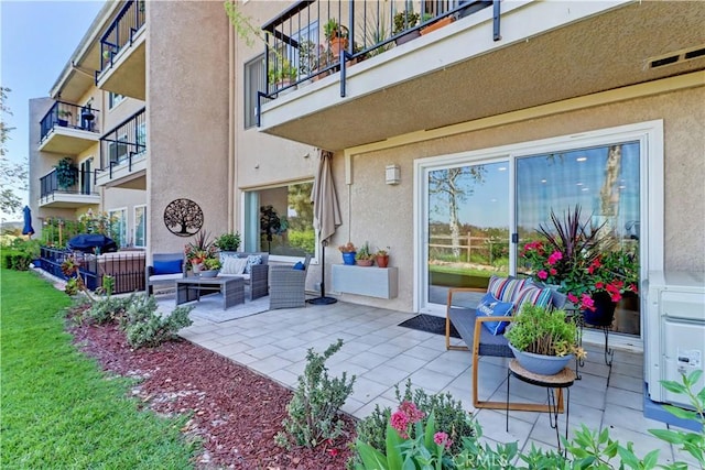 3364 Punta Alta Unit 1E, Laguna Woods, CA 92637 - view of patio with a balcony, an outdoor hangout area, and a grill
