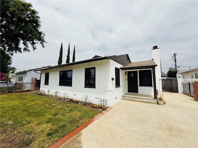 17037 Covello St, Van Nuys, CA 91406 - view of front facade with a chimney, stucco siding, a patio area, and concrete driveway