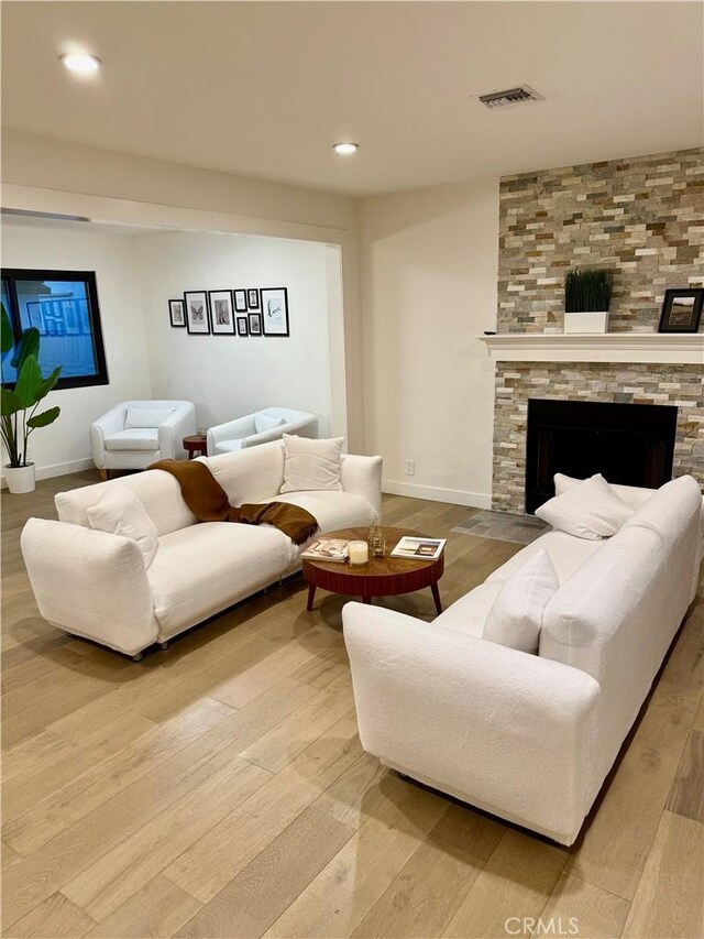 17037 Covello St, Van Nuys, CA 91406 - living room with wood finished floors, a large fireplace, and recessed lighting