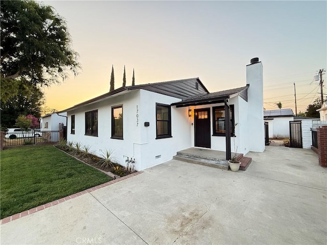 17037 Covello St, Van Nuys, CA 91406 - view of front of home with a chimney, a patio area, stucco siding, and crawl space