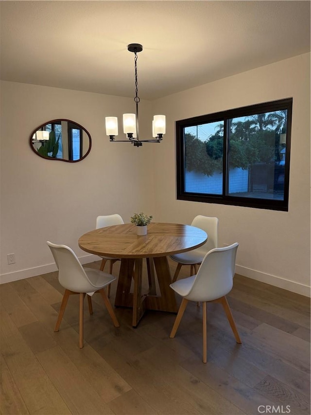 17037 Covello St, Van Nuys, CA 91406 - dining space featuring a chandelier, wood finished floors, and baseboards