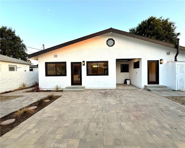 17037 Covello St, Van Nuys, CA 91406 - view of front of property featuring stucco siding, entry steps, and a patio area