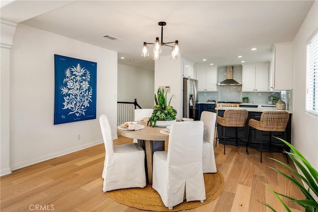2401 Vanderbilt Ln Unit B, Redondo Beach, CA 90278 - dining area with light wood-style floors, a chandelier, recessed lighting, and baseboards