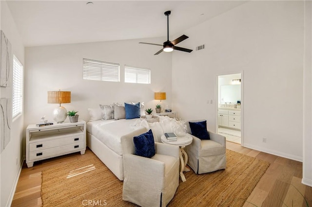2401 Vanderbilt Ln Unit B, Redondo Beach, CA 90278 - bedroom featuring light wood-style floors, connected bathroom, baseboards, a sink, and high vaulted ceiling