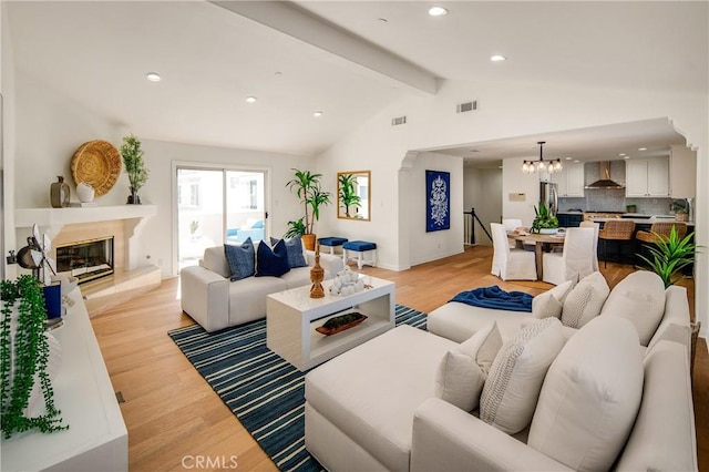 2401 Vanderbilt Ln Unit B, Redondo Beach, CA 90278 - living room featuring light wood-style flooring, a fireplace, recessed lighting, a chandelier, and baseboards