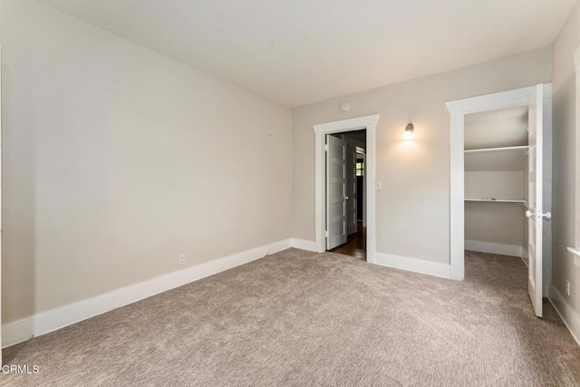 1540 Whitefield Rd, Pasadena, CA 91104 - unfurnished bedroom featuring carpet, a spacious closet, baseboards, and a closet