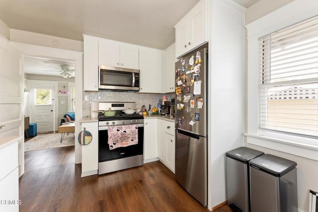 1540 Whitefield Rd, Pasadena, CA 91104 - kitchen featuring stainless steel appliances, dark wood finished floors, white cabinets, tasteful backsplash, and light countertops