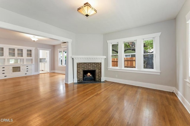 1540 Whitefield Rd, Pasadena, CA 91104 - unfurnished living room featuring wood finished floors, a fireplace, and baseboards