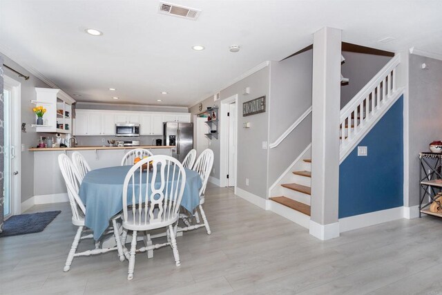 797 Trailside Pl, San Marcos, CA 92078 - dining room featuring stairway, recessed lighting, light wood-style floors, and ornamental molding