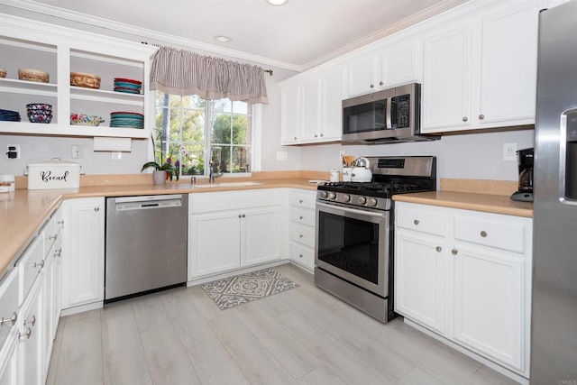 797 Trailside Pl, San Marcos, CA 92078 - kitchen with stainless steel appliances, white cabinetry, light countertops, crown molding, and recessed lighting