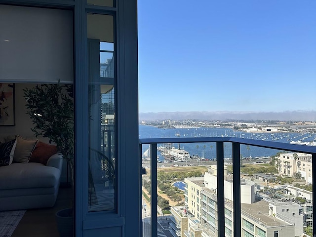 balcony with a view of city and a water view