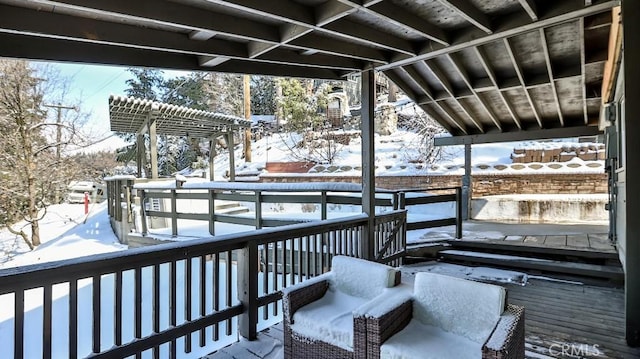 view of snow covered deck