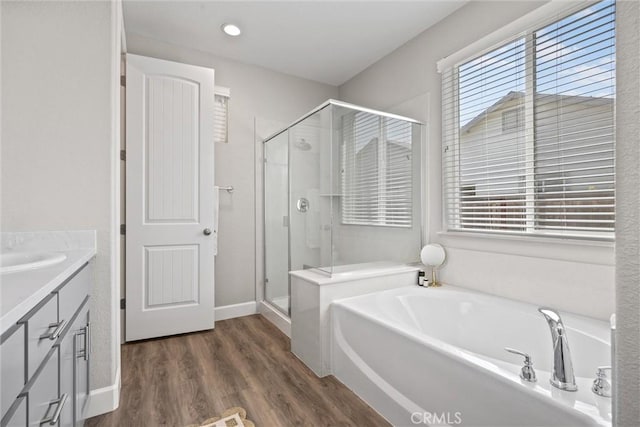 3445 Chamberlain Run, Chico, CA 95973 - full bathroom with a shower stall, a garden tub, vanity, and wood finished floors