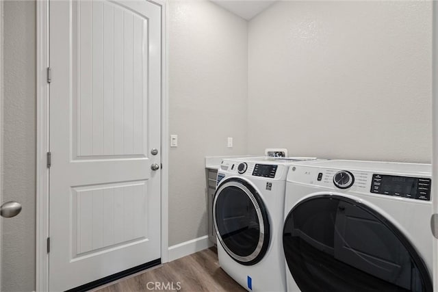 3445 Chamberlain Run, Chico, CA 95973 - clothes washing area featuring washing machine and dryer, light wood-style floors, and baseboards
