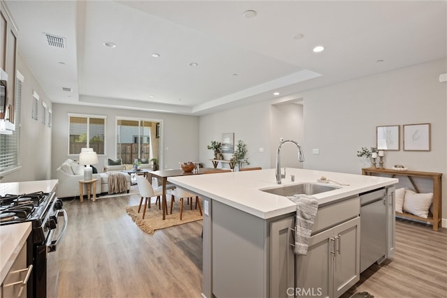3445 Chamberlain Run, Chico, CA 95973 - kitchen with a sink, gray cabinets, a raised ceiling, range with gas cooktop, and recessed lighting