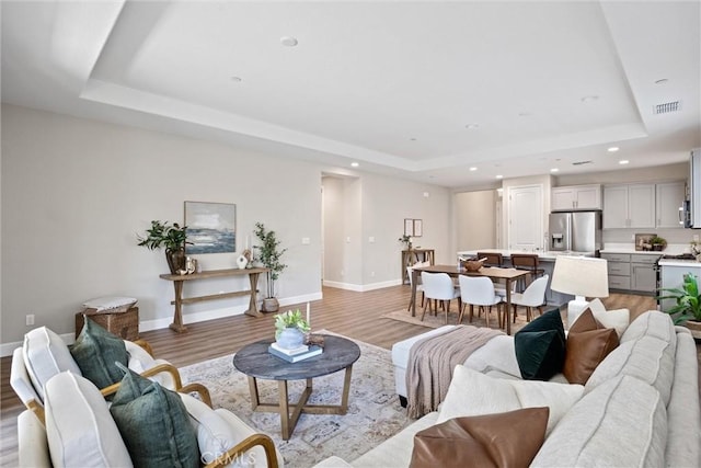 3445 Chamberlain Run, Chico, CA 95973 - living room with a raised ceiling, light wood-style floors, baseboards, and recessed lighting