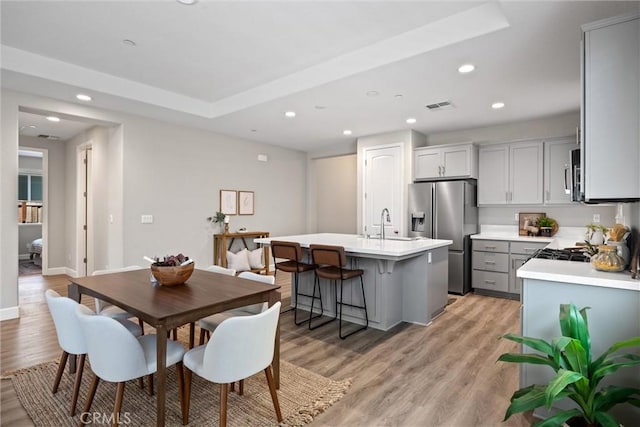 3445 Chamberlain Run, Chico, CA 95973 - dining area with recessed lighting, light wood-style flooring, and baseboards