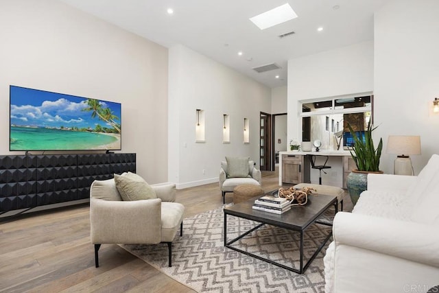1240 Berryman Cyn, Encinitas, CA 92024 - living room with light wood finished floors, a skylight, a high ceiling, recessed lighting, and baseboards