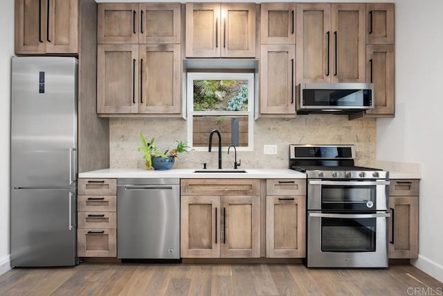 1240 Berryman Cyn, Encinitas, CA 92024 - kitchen with stainless steel appliances, a sink, and light countertops