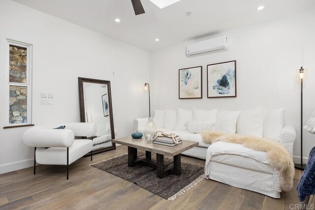 1240 Berryman Cyn, Encinitas, CA 92024 - living room with a wall mounted AC, wood finished floors, recessed lighting, baseboards, and a ceiling fan