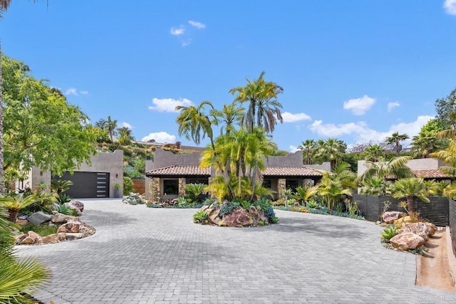 1240 Berryman Cyn, Encinitas, CA 92024 - view of front of home with curved driveway, stucco siding, and a tile roof