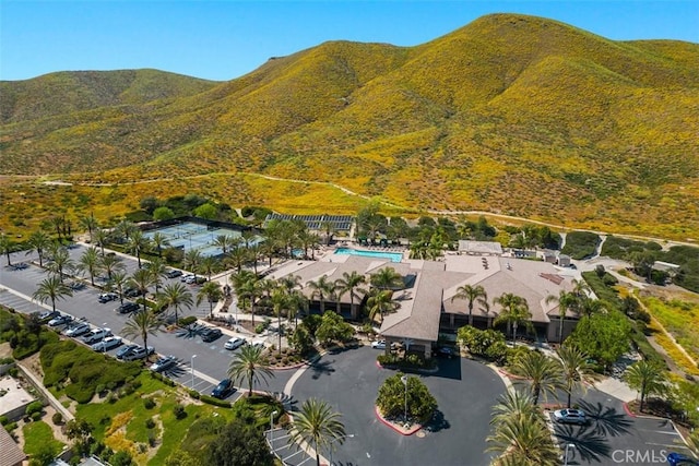 aerial overview of property's location featuring mountains and a pool area