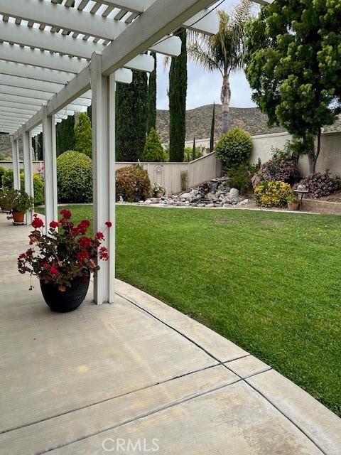 view of yard featuring a pergola and a patio