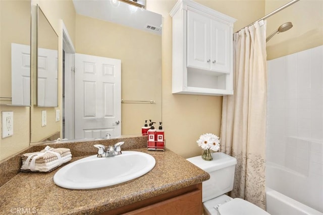 bathroom featuring vanity, toilet, and shower / bathtub combination with curtain