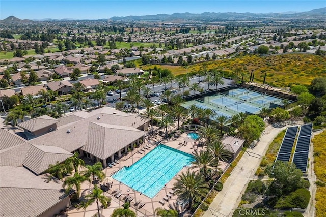 bird's eye view of a pool area and mountains
