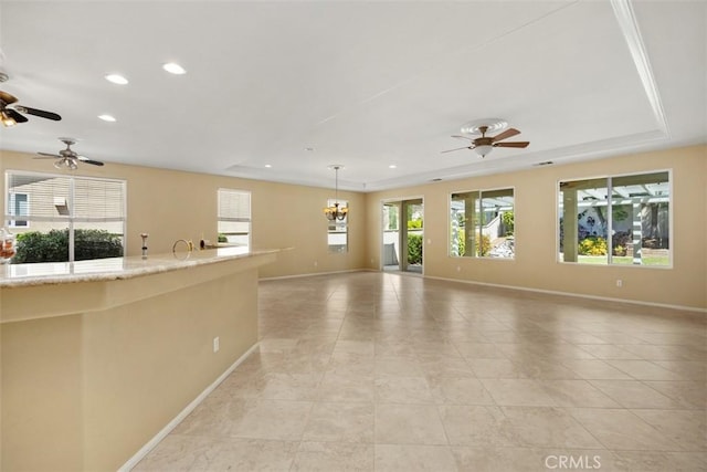 spare room with healthy amount of natural light, baseboards, ceiling fan, recessed lighting, and light tile patterned floors