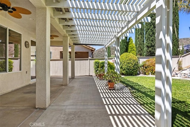 view of patio / terrace with a ceiling fan and a pergola