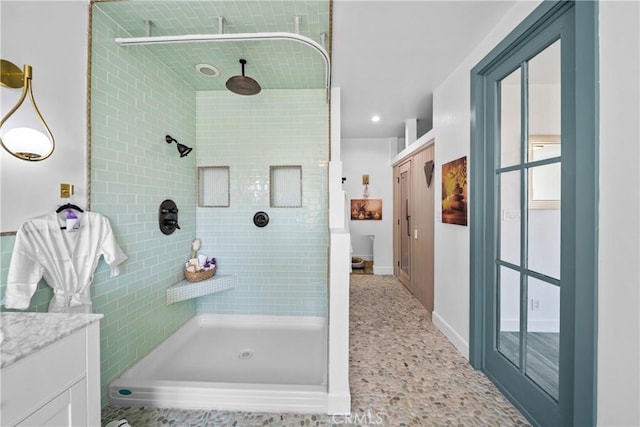 791 Cypress Rd, Lake Arrowhead, CA 92321 - full bathroom featuring tiled shower, vanity, baseboards, and recessed lighting