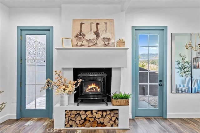 791 Cypress Rd, Lake Arrowhead, CA 92321 - detailed view of wood finished floors, a warm lit fireplace, and baseboards