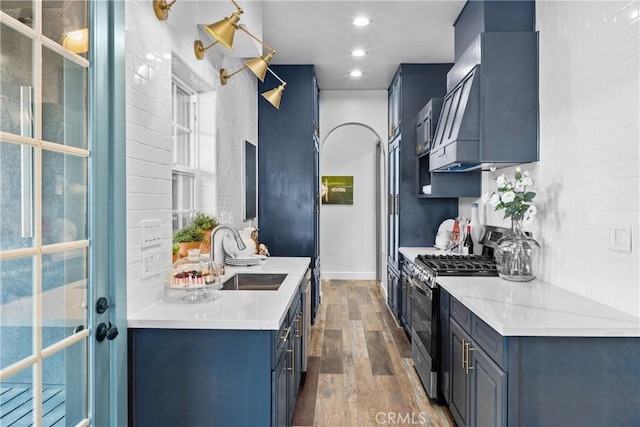 791 Cypress Rd, Cedar Glen, CA 92321 - kitchen with gas range, wood finished floors, light countertops, recessed lighting, and blue cabinets