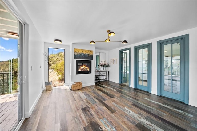 791 Cypress Rd, Cedar Glen, CA 92321 - unfurnished living room featuring wood finished floors and a glass covered fireplace