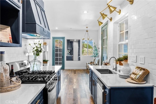791 Cypress Rd, Lake Arrowhead, CA 92321 - kitchen featuring stainless steel appliances, blue cabinets, dark wood-type flooring, decorative backsplash, and a sink