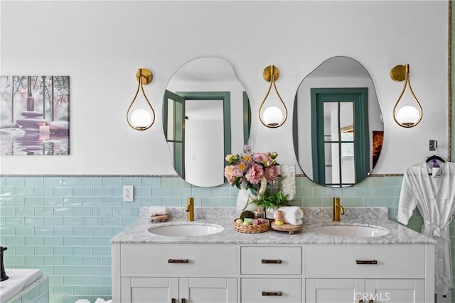 791 Cypress Rd, Lake Arrowhead, CA 92321 - full bathroom with tile walls, double vanity, and a wainscoted wall